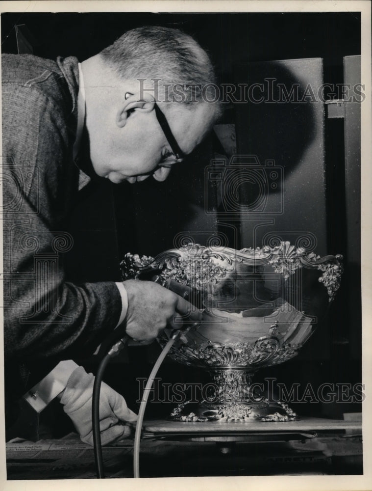 1964 Press Photo Davis Cup gets touch up polishing job - nes31517- Historic Images