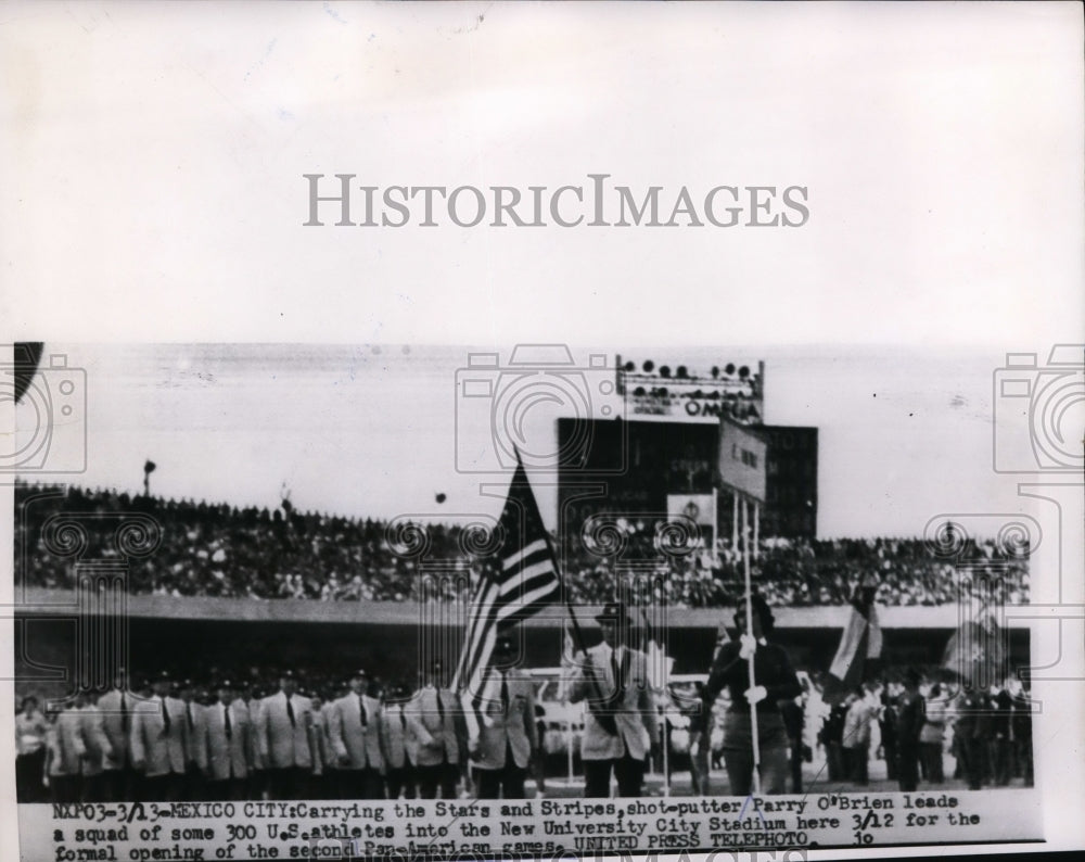 1955 Parry OBrien leads US athletes into New University City Stadium - Historic Images