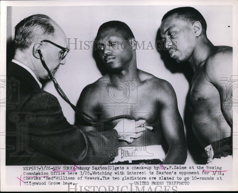 1953 Press Photo Johnny Saxton &amp; Charles Red Williams check by Dr F Zaine in NY - Historic Images