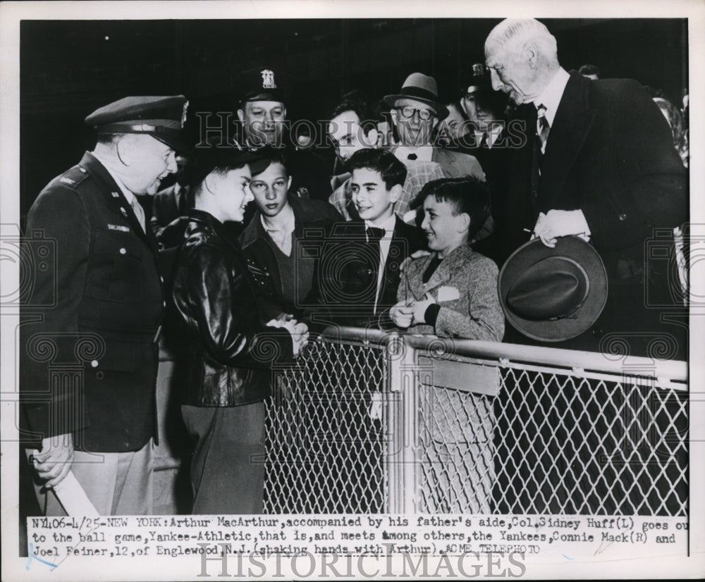 1951 Press Photo Arthur MacArthur &amp; dad&#39;s aide Col Sidney Huff at Yankee game - Historic Images