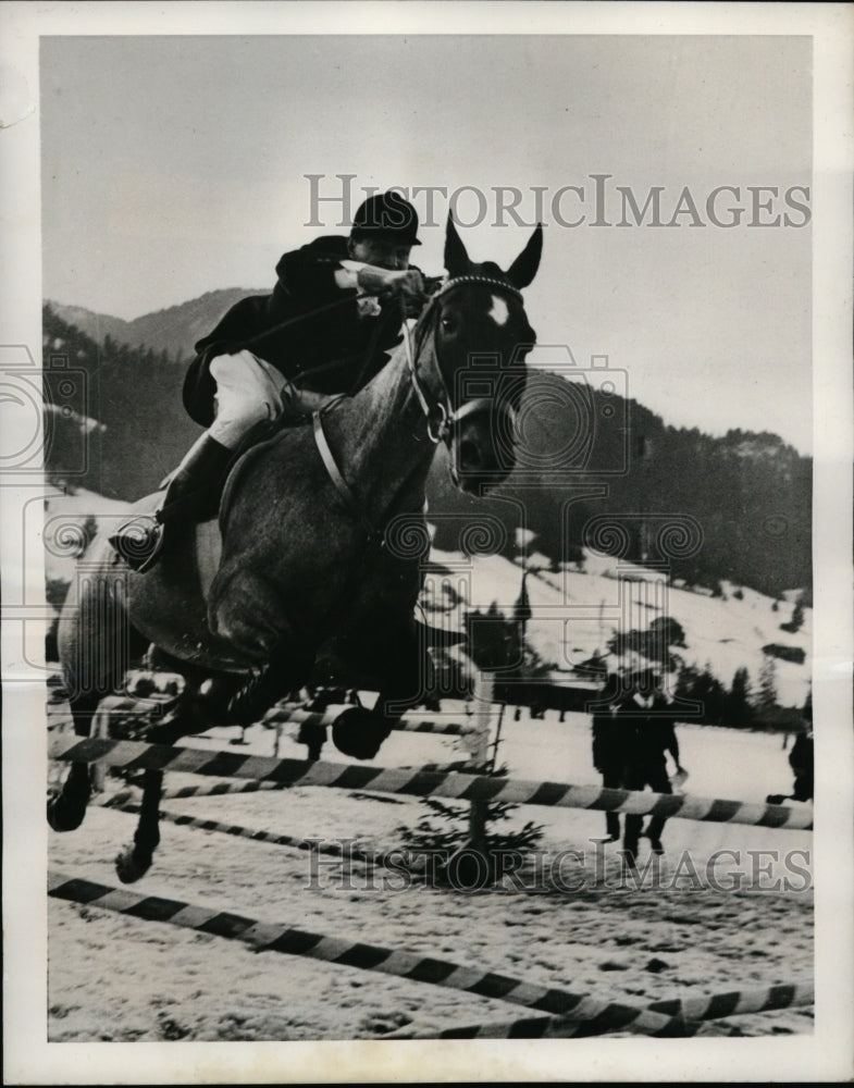 1940 Press Photo Horse &amp; rider take a jump at winter race in Swiss Alps- Historic Images