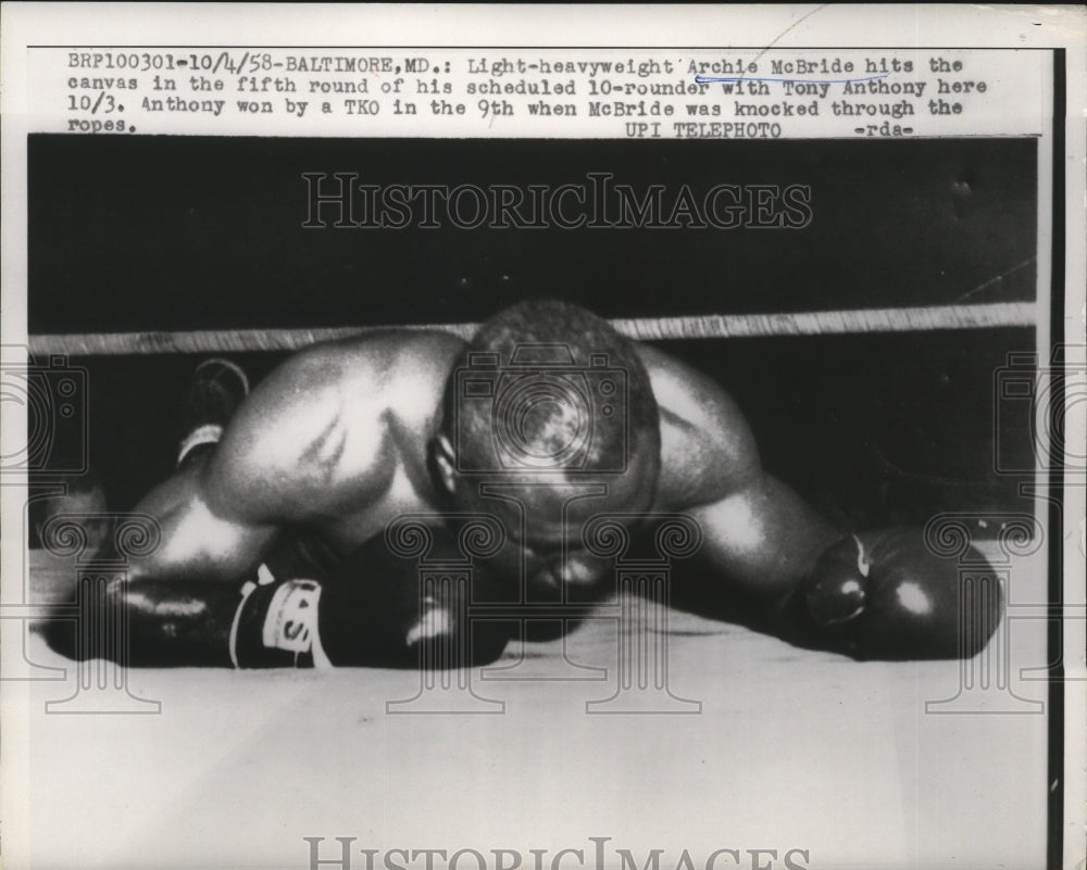 1958 Press Photo Boxer Archie McBride knocked down by Tony Anthony - nes50903 - Historic Images