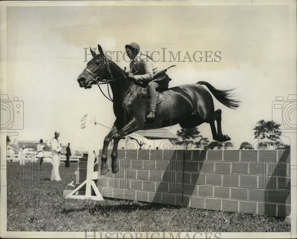 1931 Press Photo Glen G. Morehead completes a jump over brick wall on horse - Historic Images