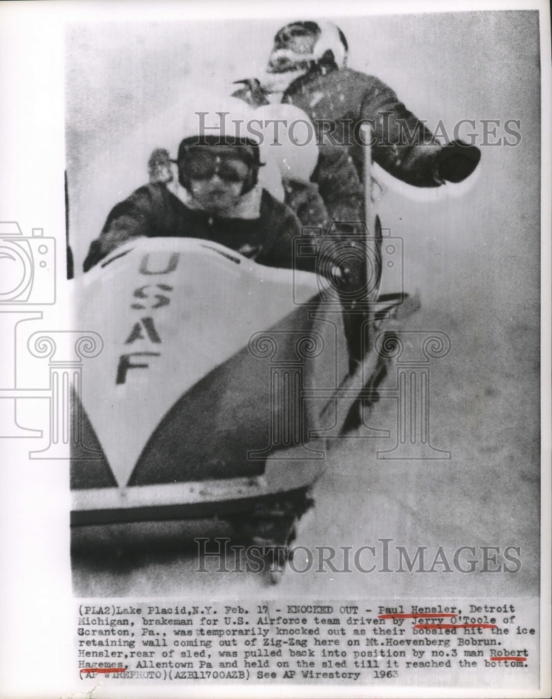 1963 Press Photo US Bobsledder Paul Hensler knocked out during bobsled run- Historic Images