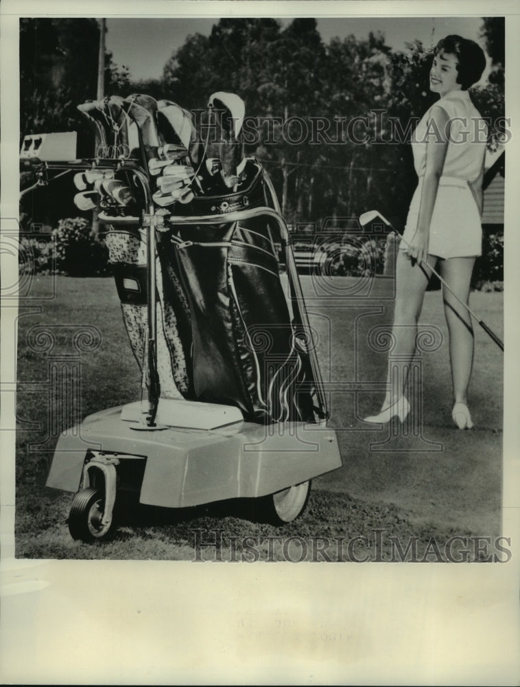 1961 Press Photo Rae Demler with Electric Golf Caddy - nes55732- Historic Images