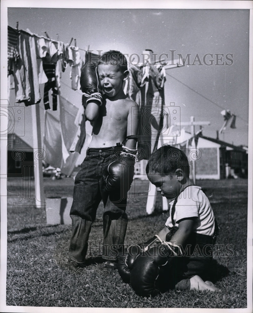 1954 Mike Herrin cries after brother Mark punches him while Boxing-Historic Images