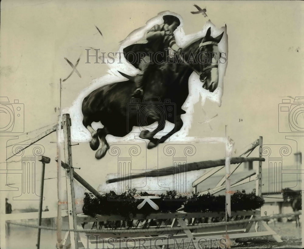 1940 Press Photo A rider takes her horse over a jump at a show - net04694- Historic Images