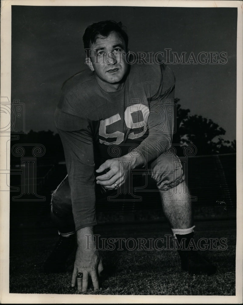 1954 A college football player on a practice field  - Historic Images