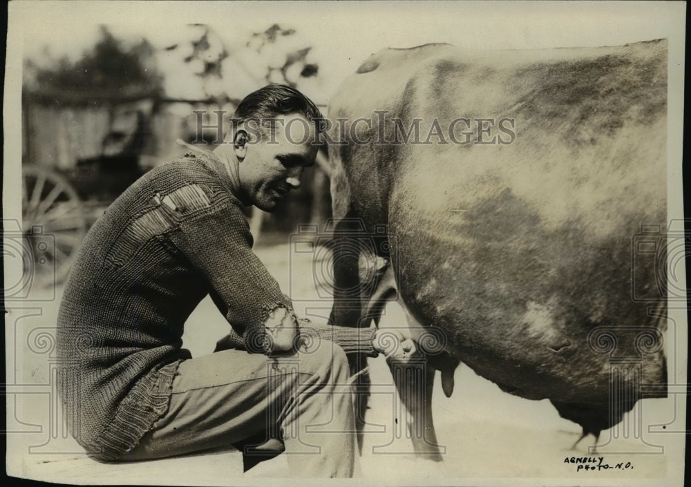 1921 Press Photo Boxer Happy Littleton milks pet cow Bossy - net17006- Historic Images