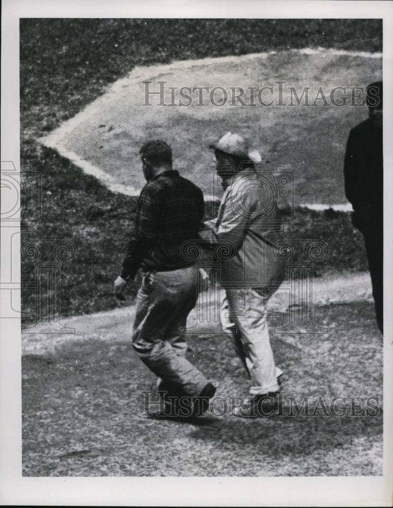 1966 Press Photo Fan taken off field after handshake with Yankee Elston Howard- Historic Images