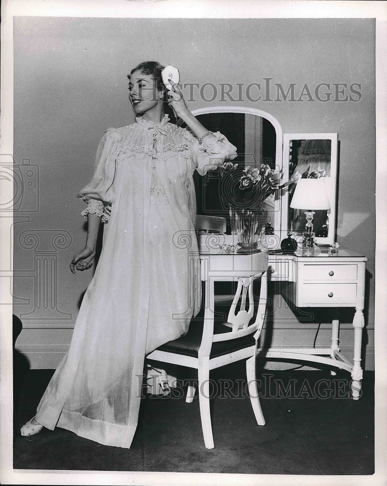 1953 Press Photo Lovely Woman Modeling Fashions for a June Bride on Chair - Historic Images