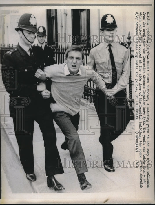 1967 Press Photo Youth Led From Chinese Legation- Historic Images