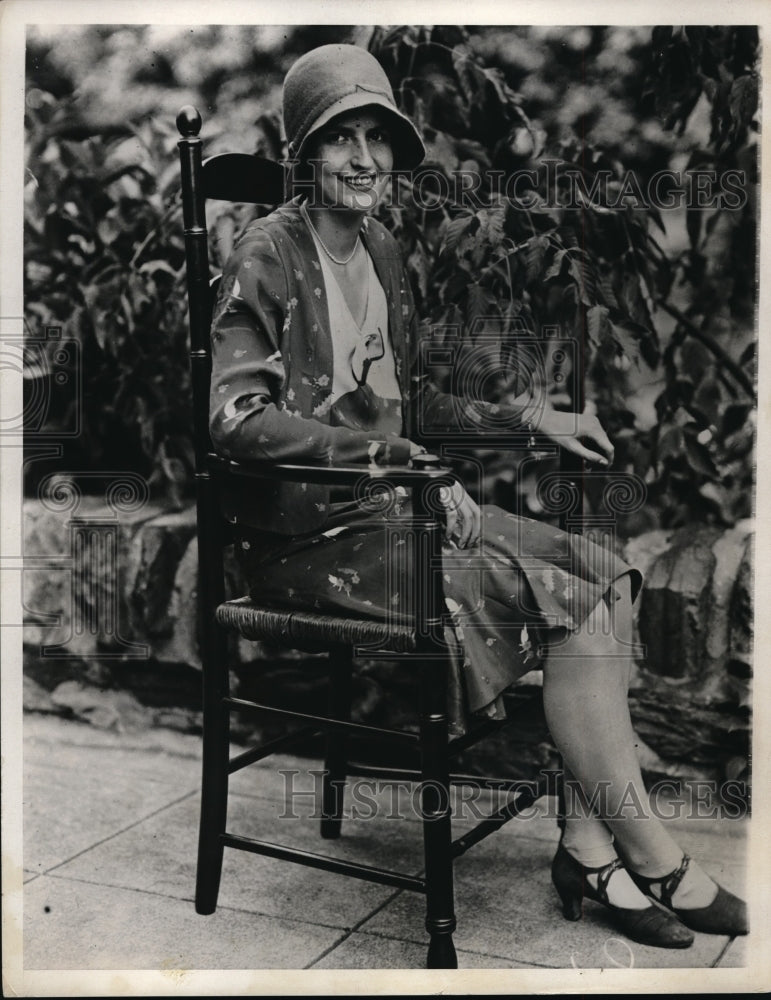 1931 Press Photo Woman sitting in chair on Patio - Historic Images