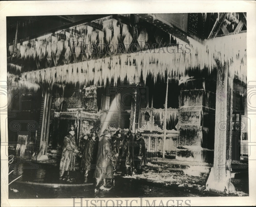 1931 Press Photo Firemen battle a fire in freezing weather at Greenwich Street - Historic Images