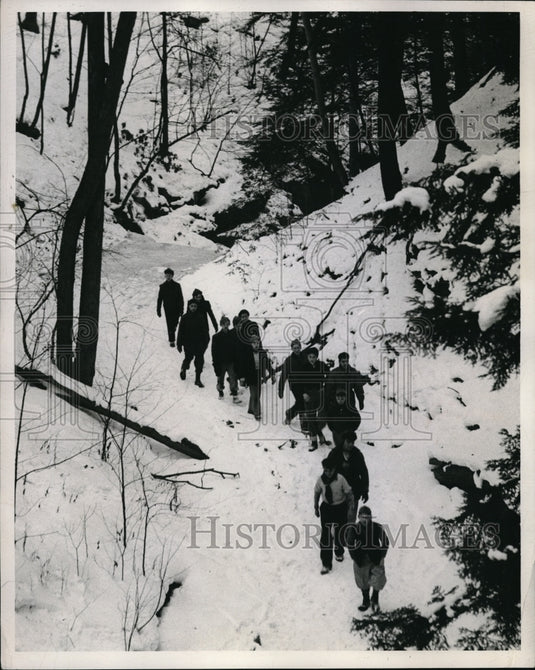 Press Photo Boy Scouts Hiking Through Snowy Wooded Forest - Historic Images