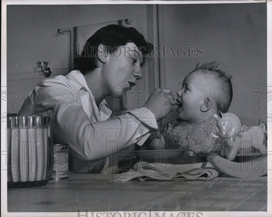 1950 Press Photo St Jacques Sr student & baby at foundling home-Historic Images