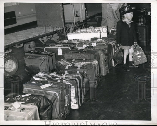1956 Press Photo Arthur Nickols Stands Over Family Luggage in Copenhagen - Historic Images
