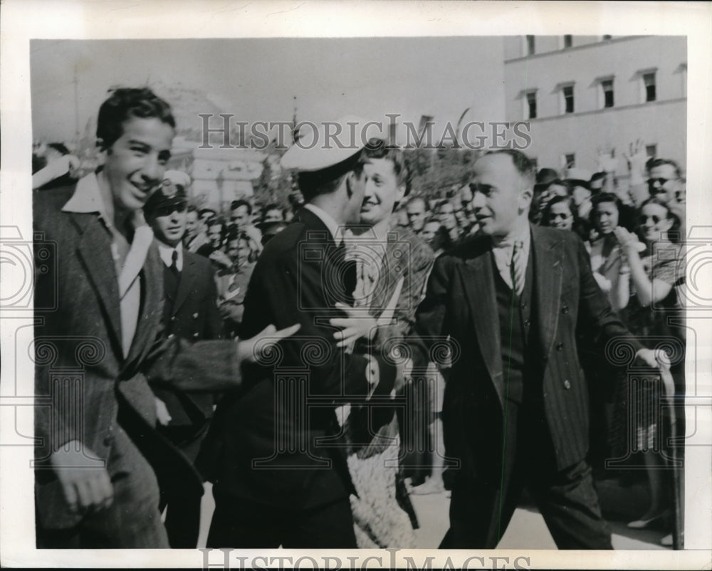 1944 Press Photo Athens Greece Woman greets cousin in sailors parade- Historic Images