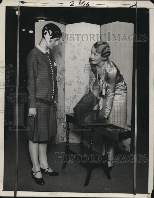 Press Photo Woman flips back top after releasing spring by pulling drawer out-Historic Images