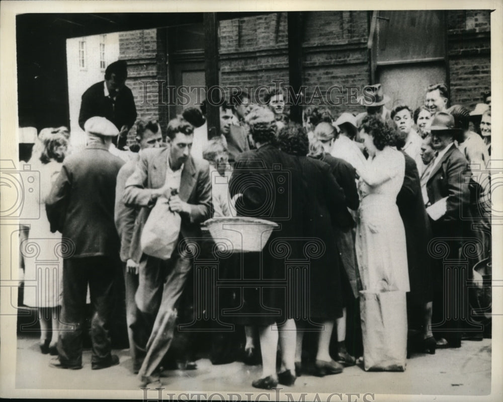 1943 Man with Bag Runs Off with Potatoes As Police Stop Dealer Sell - Historic Images