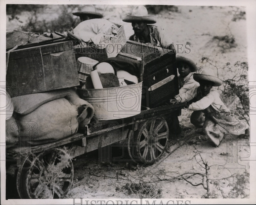 1938 Peasants flee after rebel violence in La Borreguita, Mexico - Historic Images