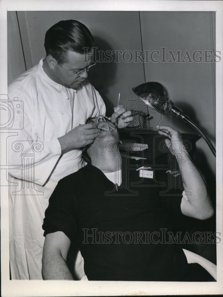 1945 Clifford Bruso Having Teeth Checked by Lt John Stillman - Historic Images