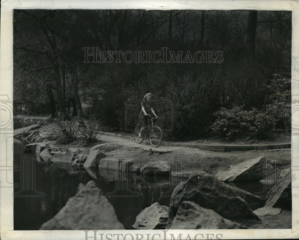 1942 Girl Riding Bicycle Along Outdoor Path  - Historic Images