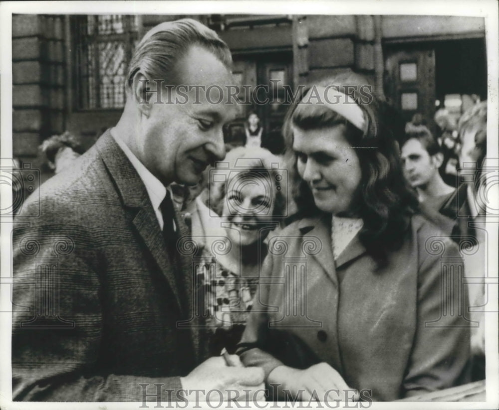 1968 Press Photo Alexander Dubank Signs Autographs as Citizens Greet Him - Historic Images