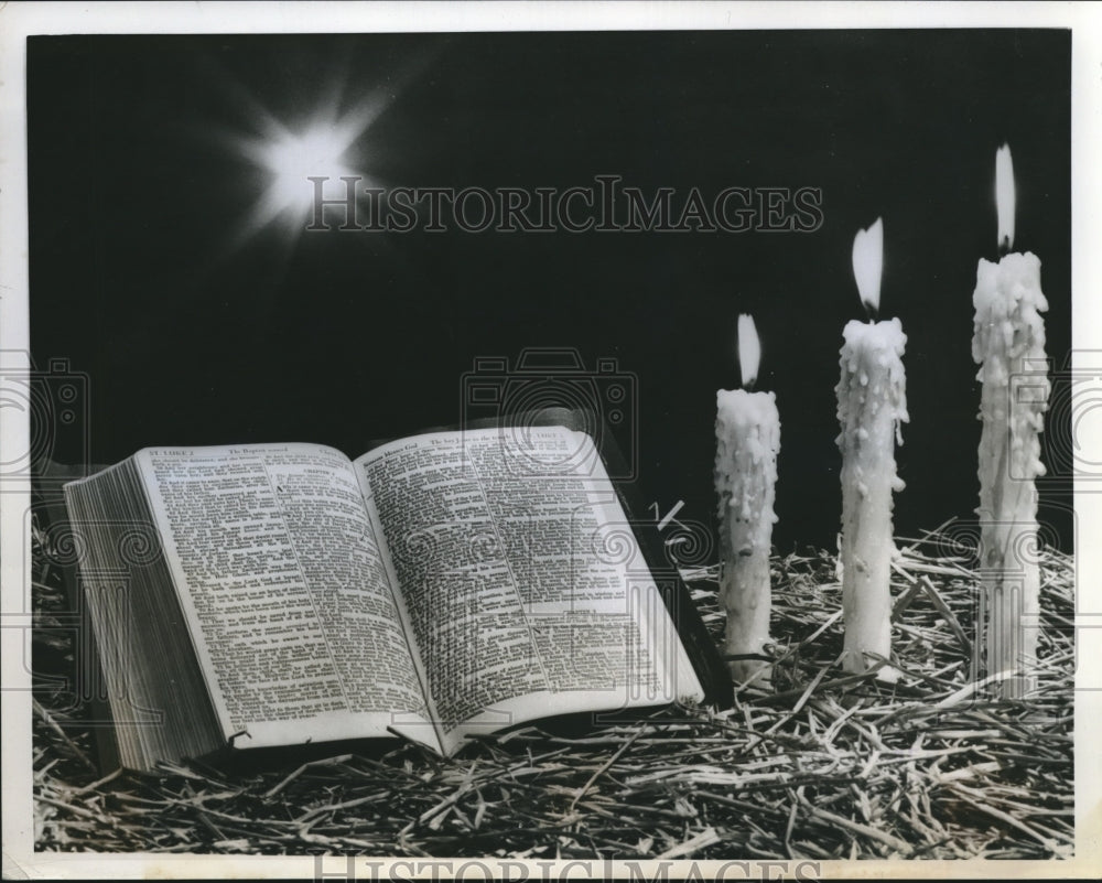 1958 Press Photo Scene of Christmas Spirit Captured with Bible, Star &amp; Candles - Historic Images