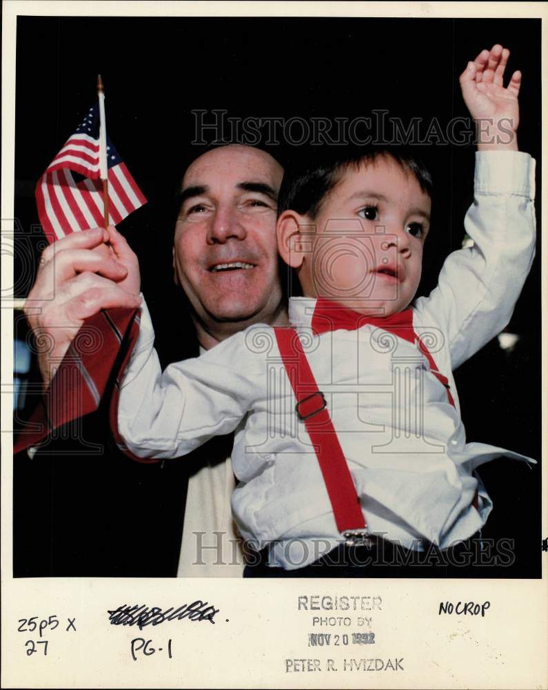 1992 Press Photo Normal Glover holds godson at citizenship ceremony in Hartford - Historic Images