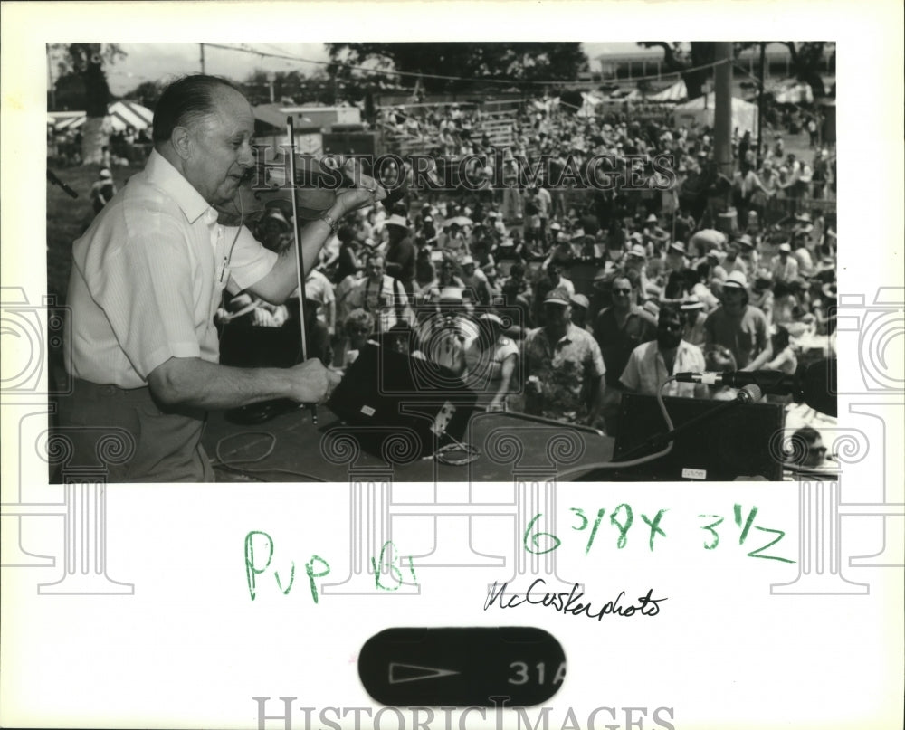 1989 New Orleans Jazz Festival - Cajun fiddler Chuck Guillory plays. - Historic Images