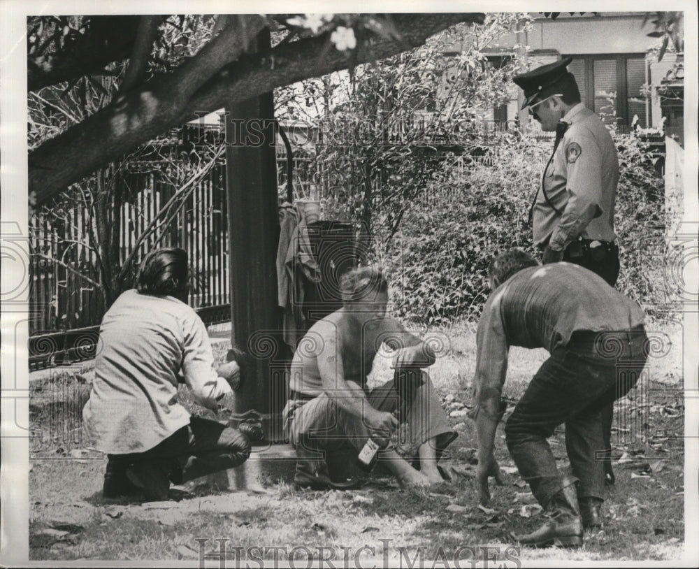 1975 Policemen Talk to Drunken Man in Jackson Square, Mississippi - Historic Images