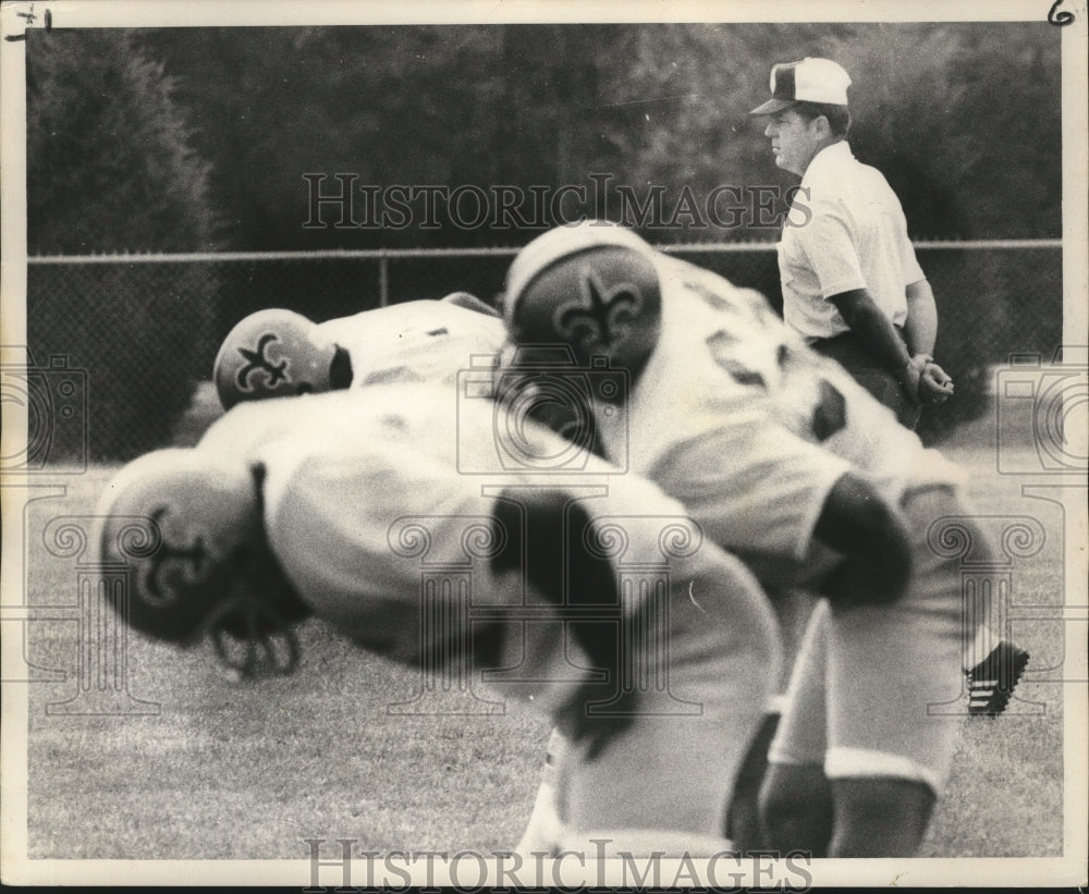 1972 Coach Standing by New Orleans Saints Players at Practice - Historic Images