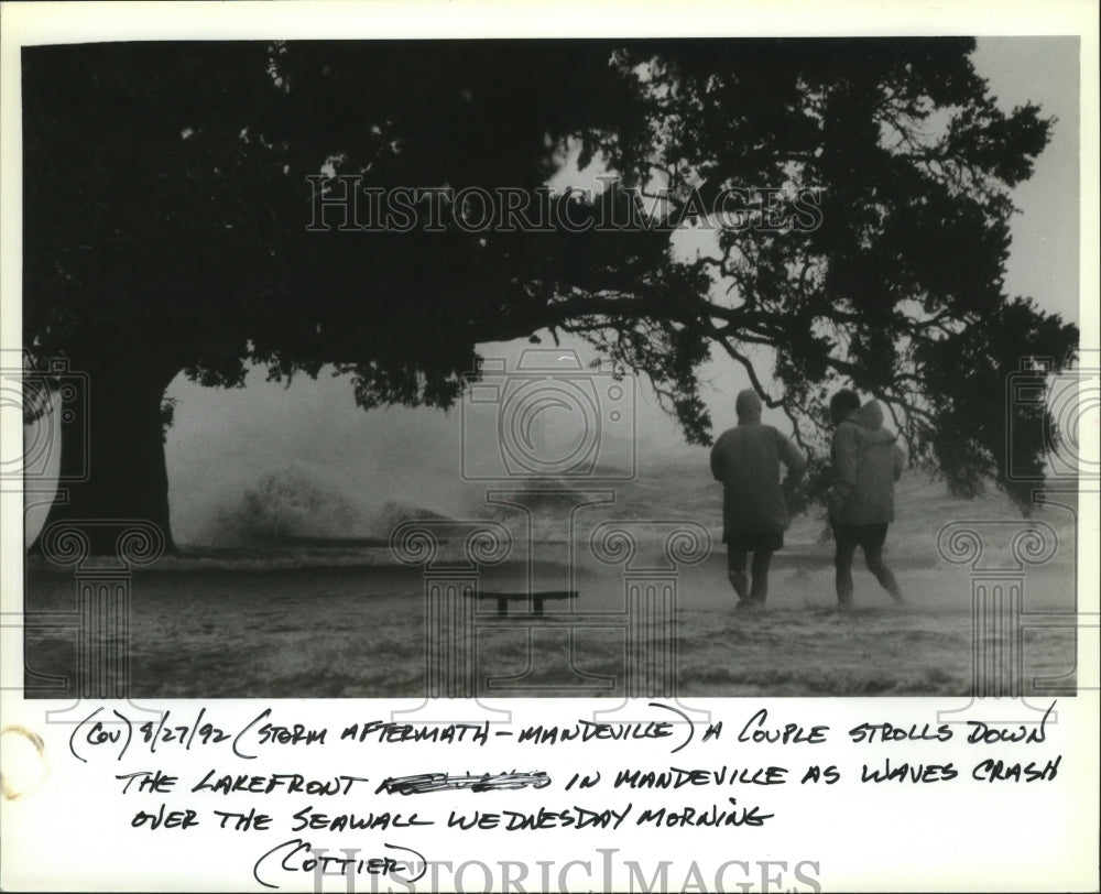 1992 Hurricane Andrew - A couple on the lakefront in Mandeville. - Historic Images