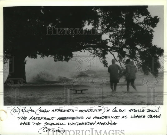 1992 Hurricane Andrew - A couple on the lakefront in Mandeville. - Historic Images