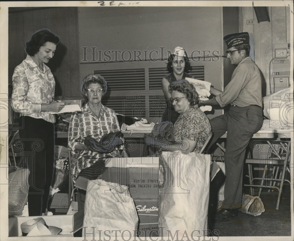 1964 Hurricane Hilda - Volunteers help load donations for victims. - Historic Images