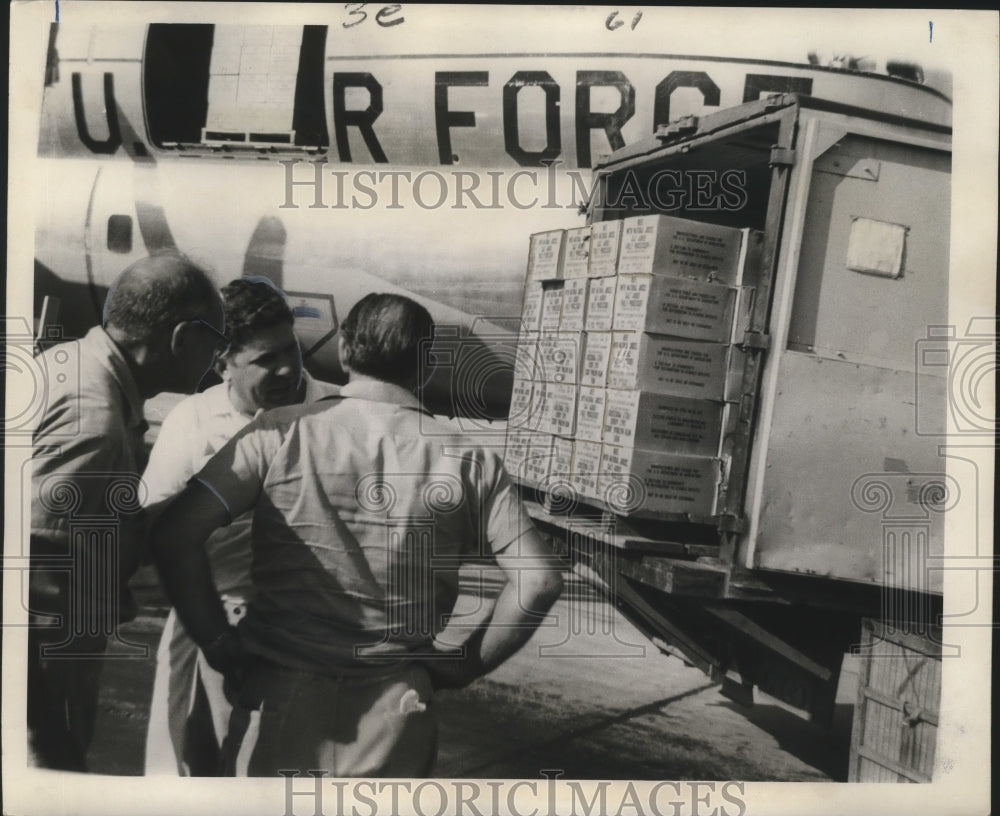 1965 Food For Storm Victims Arrives at Alvin Callender Airfield - Historic Images