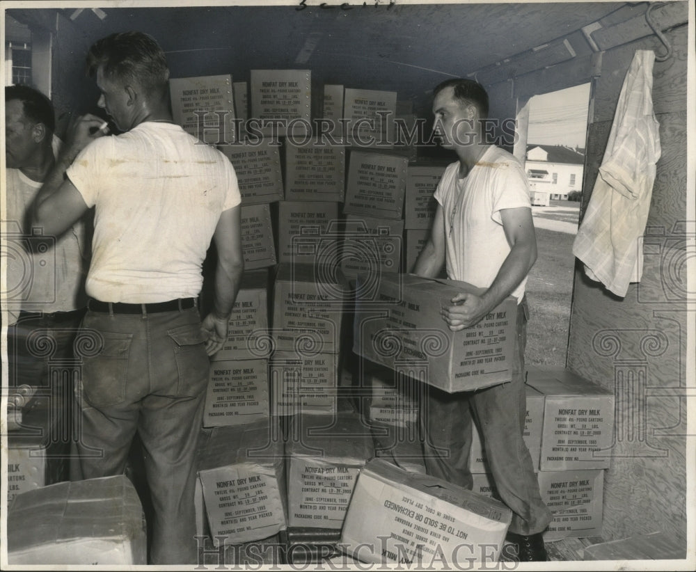 1965 Hurricane Betsy Rescue Workers Unloading Donated Food Items - Historic Images