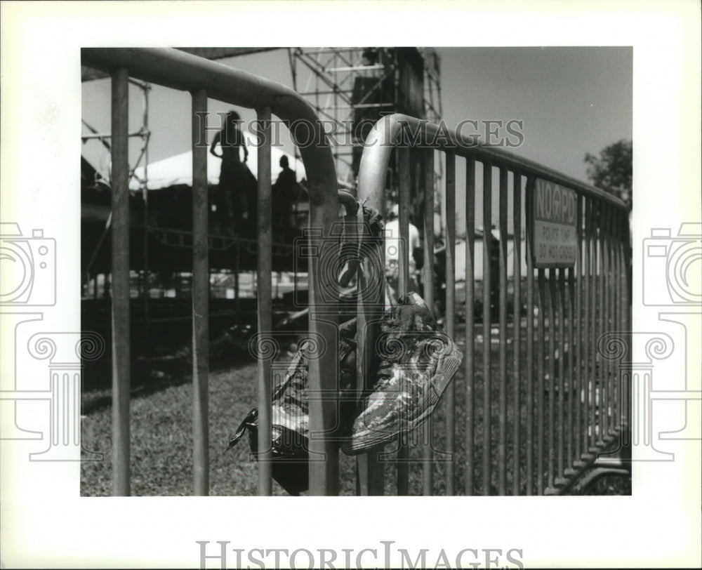 1993 New Orleans Jazz Festival - Tennis shoes on police barricade. - Historic Images