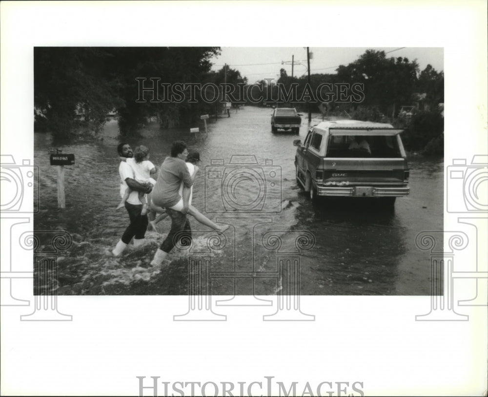 1992 Residents Head for Trucks as Water Rises, Hurricane Andrew - Historic Images