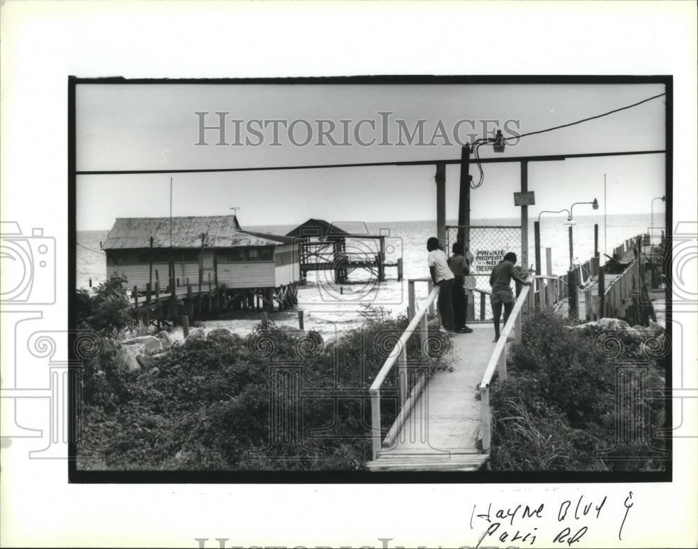 1992 Kids Looking at Waves Coming Overcamps, Hurricane Andrew - Historic Images