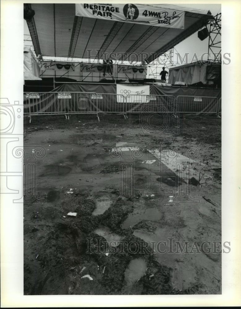 1991 New Orleans Jazz Festival - Standing water and muddy footprints - Historic Images