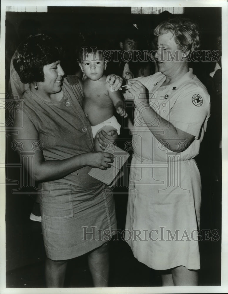 Hurricane Celia- Rogelio Menchea receives tetanus-typhoid shot. - Historic Images