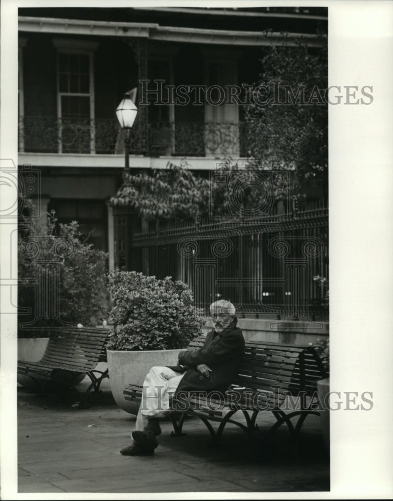 1994 Man sitting on bench in Jackson Square. - Historic Images