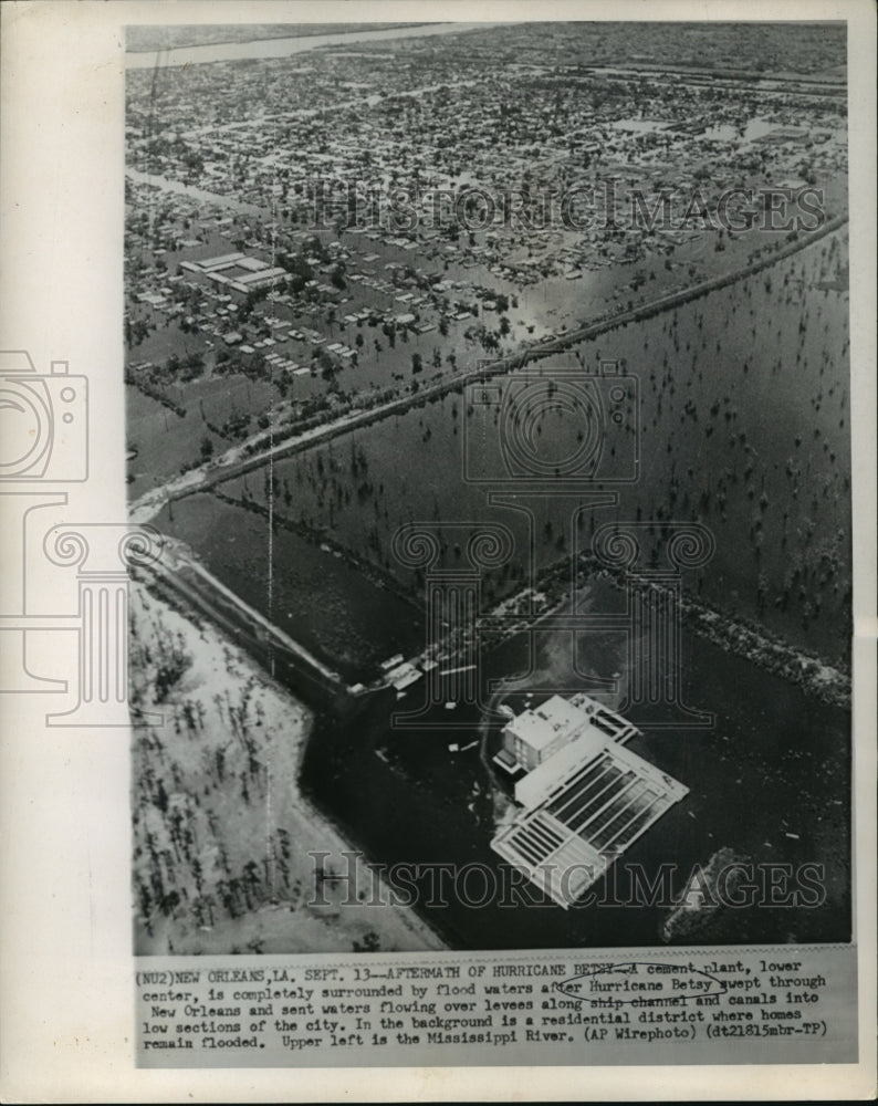 1965 Hurricane Betsy- A cement plant surrounded by flood waters. - Historic Images