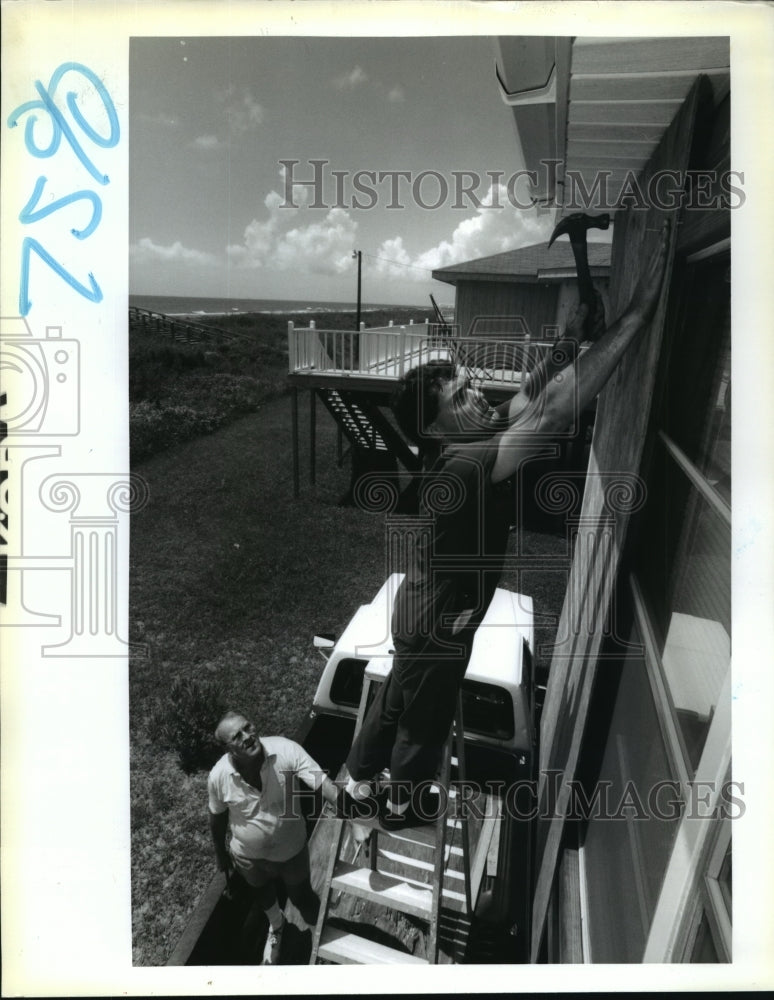 1992 Hurricane Andrew- Preparations underway at Grand Isle Camp. - Historic Images