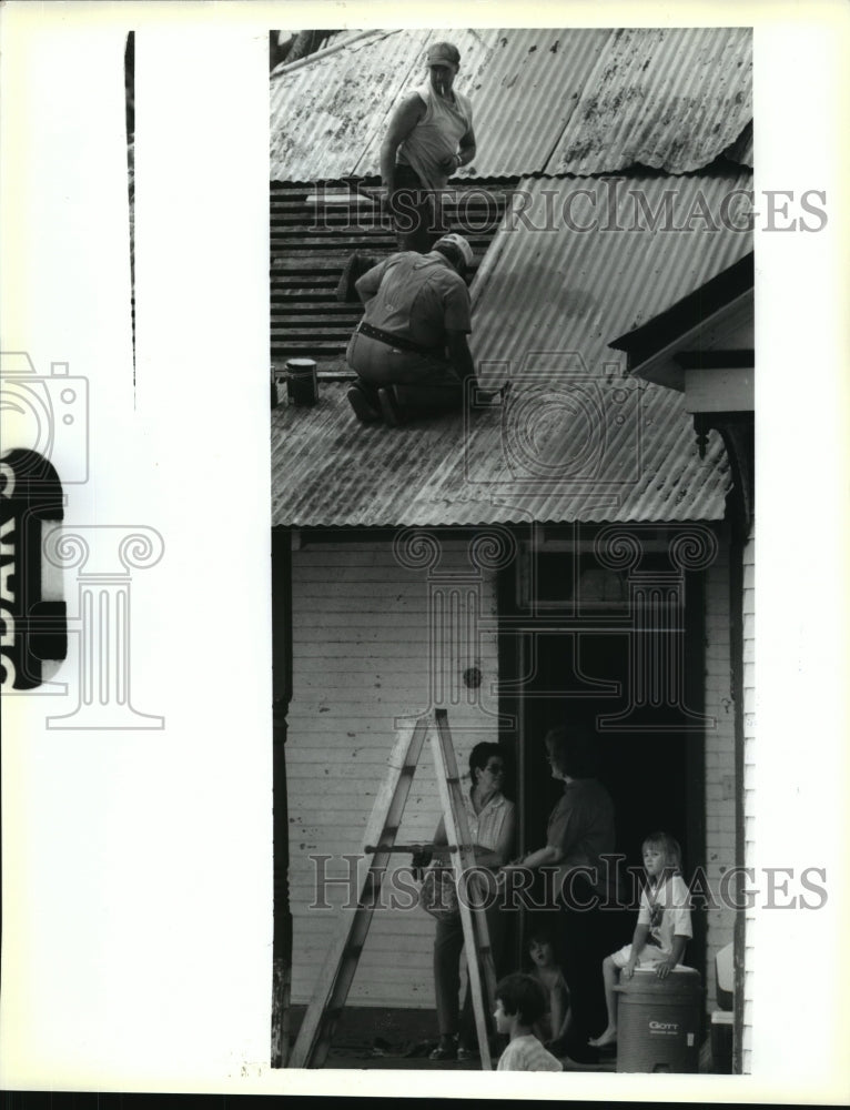 1992 Hurricane Andrew- Charles Bolton and Troy Wimberly work on roof - Historic Images