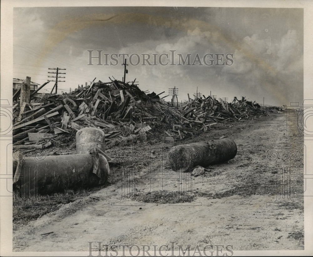 1965 Hurricane Betsy - Piles of debris on Lake Catherine at Hwy. 90. - Historic Images