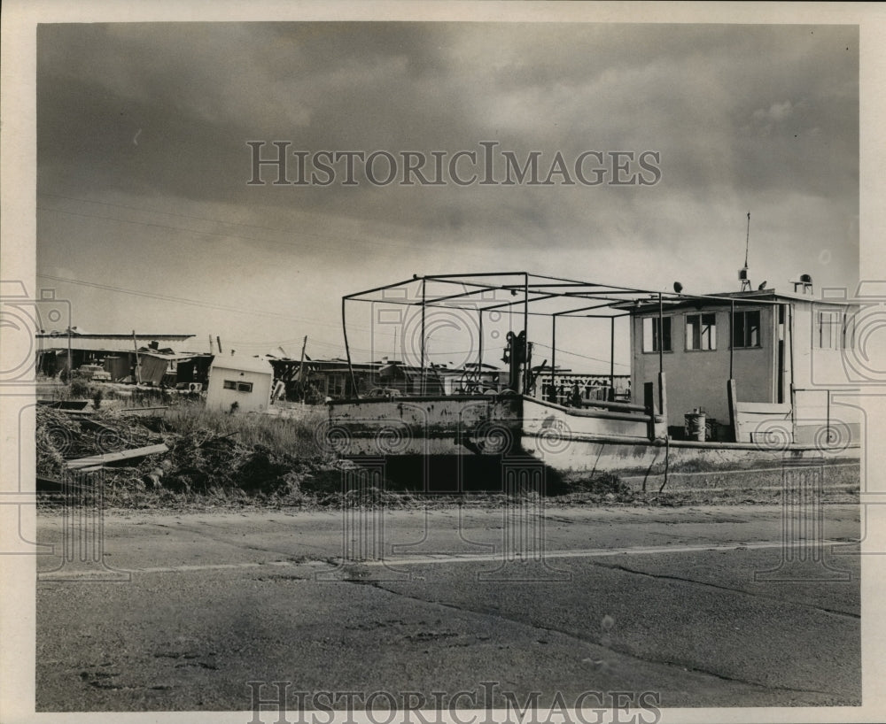 1965 Hurricane Betsy - A damaged boat and debris at Lake Catherine. - Historic Images