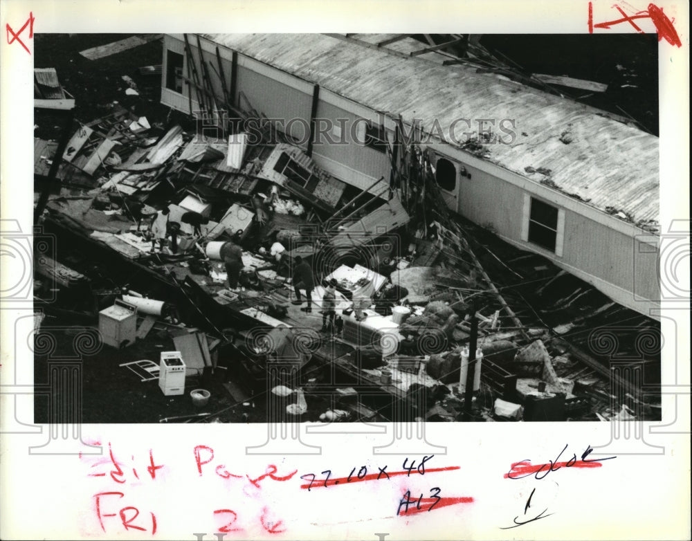 1992 Hurricane Andrew-People pick through remains of trailer home. - Historic Images